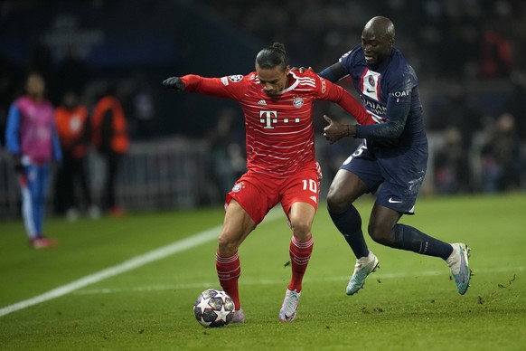 Bayern&#039;s Leroy Sane, left, duels for the ball with PSG&#039;s Danilo Pereira during the Champions League round of 16 first leg soccer match between Paris Saint Germain and Bayern Munich, at the P ...