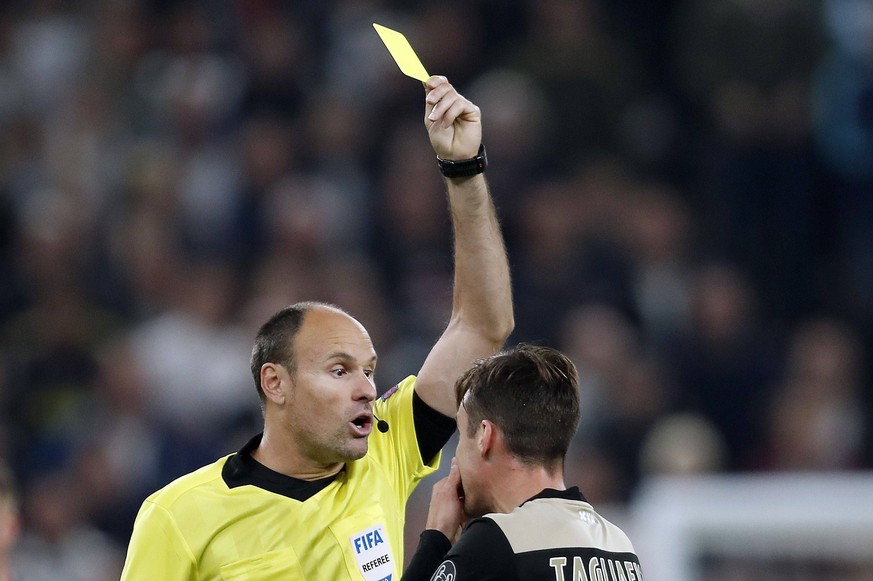 (L-R) referee Antonio Mateu Lahoz, Nico Tagliafico of Ajax during the UEFA Champions League semi final match between Tottenham Hotspur FC and Ajax Amsterdam at the Tottenham Hotspur stadium on April 3 ...