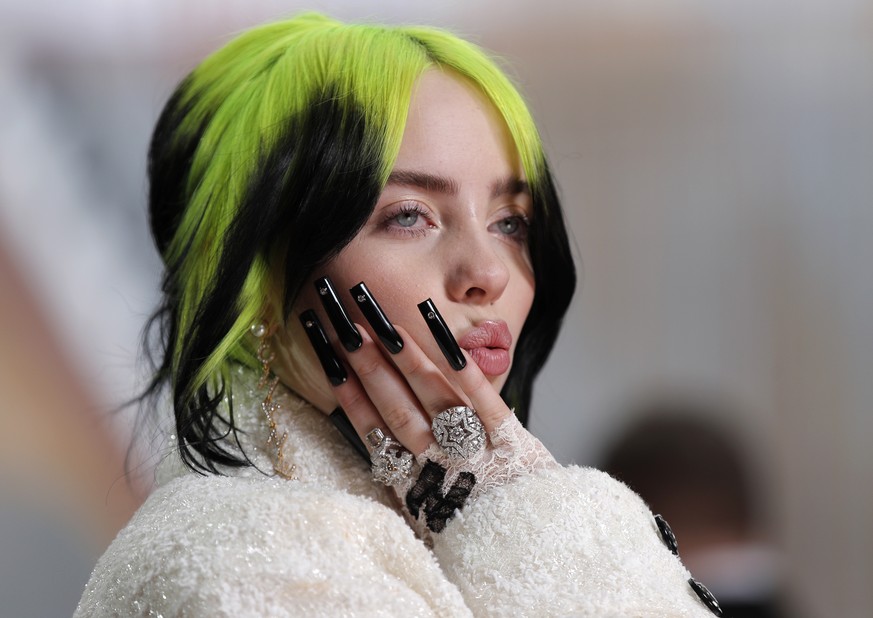 FILE - In this Feb. 9, 2020, file photo, singer Billie Eilish arrives at the Oscars in Los Angeles. Billie Eilish scored 12, 2020 Billboard Music Awards nominations, dick clark productions and NBC ann ...