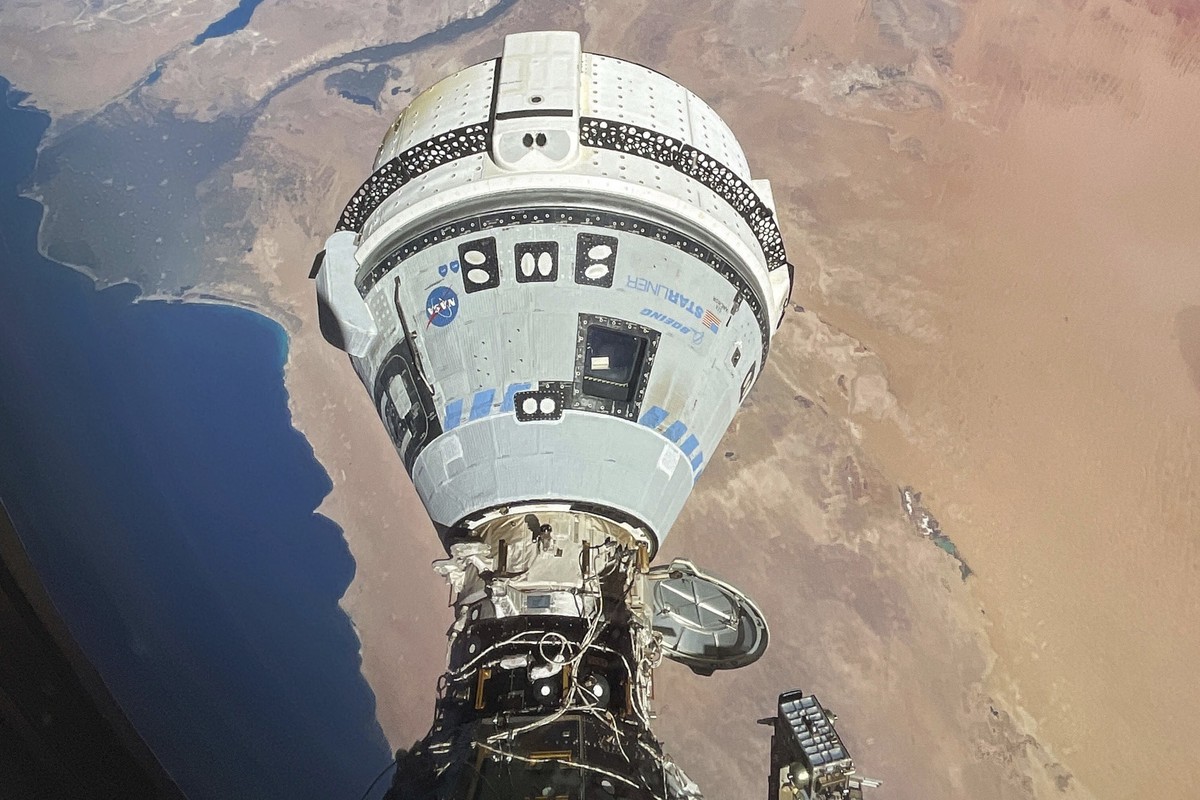 This photo provided by NASA shows the Starliner spacecraft docked to the Harmony module of the International Space Station, orbiting 262 miles above Egypt's Mediterranean coast, on June 13, 2024. ...