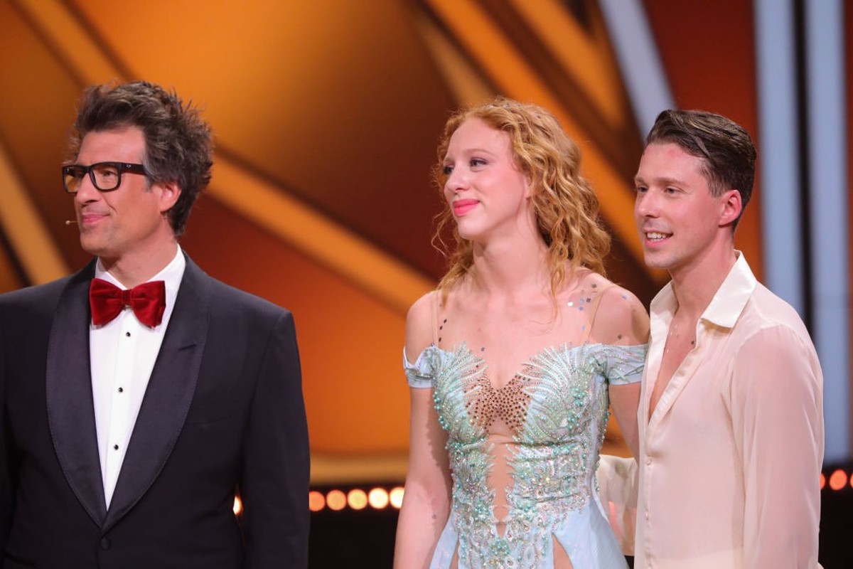 COLOGNE, GERMANY - MAY 19: Anna Ermakova and Valentin Lusin talk to Host Daniel Hartwich and the jury after their performance during the finals of the 16th season of the television competition show &q ...