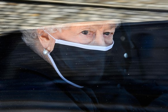 WINDSOR, ENGLAND - APRIL 17: Queen Elizabeth II during the funeral of Prince Philip, Duke of Edinburgh at Windsor Castle on April 17, 2021 in Windsor, England. Prince Philip of Greece and Denmark was  ...