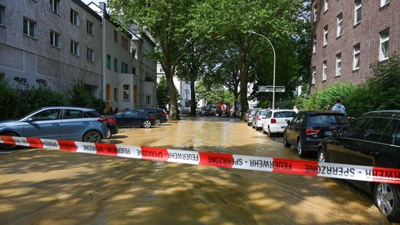 A flooded street is seen after storm &quot;Lambert&quot; hit the city of Dortmund, western Germany, on June 23, 2023. (Photo by Ina FASSBENDER / AFP) (Photo by INA FASSBENDER/AFP via Getty Images)