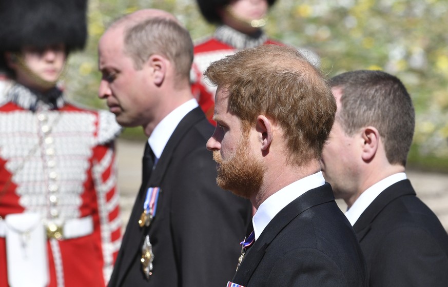 Prince William and Prince Harry follow the coffin during a procession arriving at St George&#039;s Chapel for the funeral of Britain&#039;s Prince Philip inside Windsor Castle in Windsor, England, Sat ...