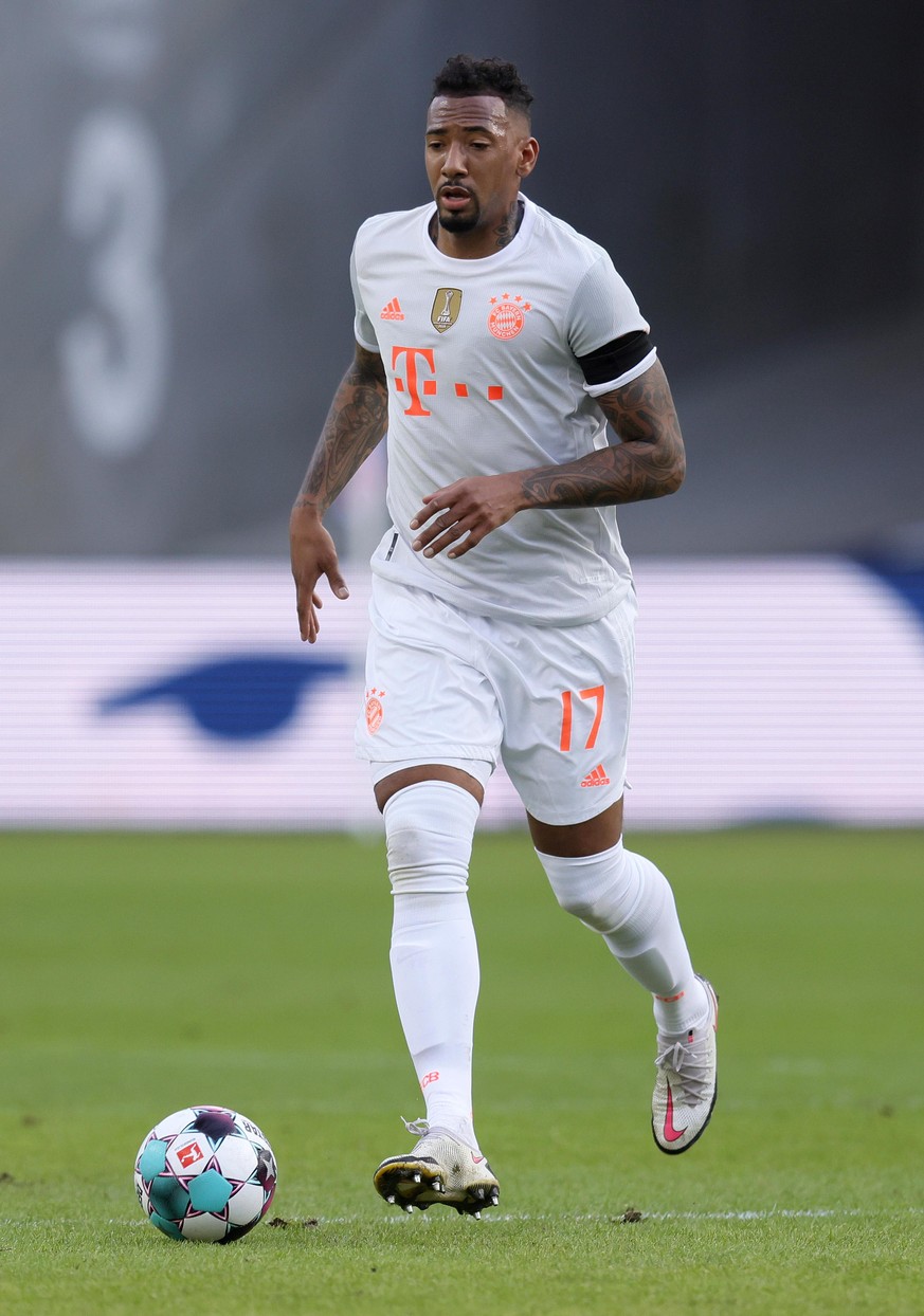 FRANKFURT AM MAIN, GERMANY - FEBRUARY 20: Jerome Boateng of FC Bayern Muenchen runs with the ball during the Bundesliga match between Eintracht Frankfurt and FC Bayern Muenchen at Deutsche Bank Park o ...