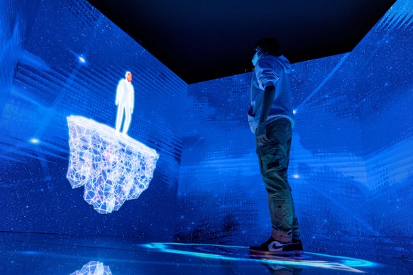 January 23, 2022, Madrid, Spain: A kid creates his Avatar at FITUR. HELIXA Experience Center is the technological and artistic installation in the heart of the FITUR fair. It will be the first to offe ...