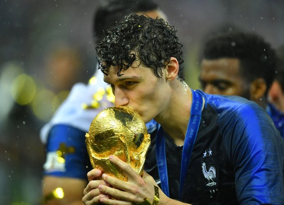 Soccer Football - World Cup - Final - France v Croatia - Luzhniki Stadium, Moscow, Russia - July 15, 2018 France&#039;s Benjamin Pavard kisses the trophy as he celebrates winning the World Cup REUTERS ...