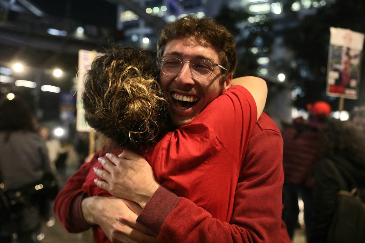 250115 -- TEL AVIV, Jan. 15, 2025 -- Relatives and supporters of hostages held in the Gaza Strip embrace each other amid reports of a ceasefire deal between Israel and Hamas, in Tel Aviv, Israel, on J ...