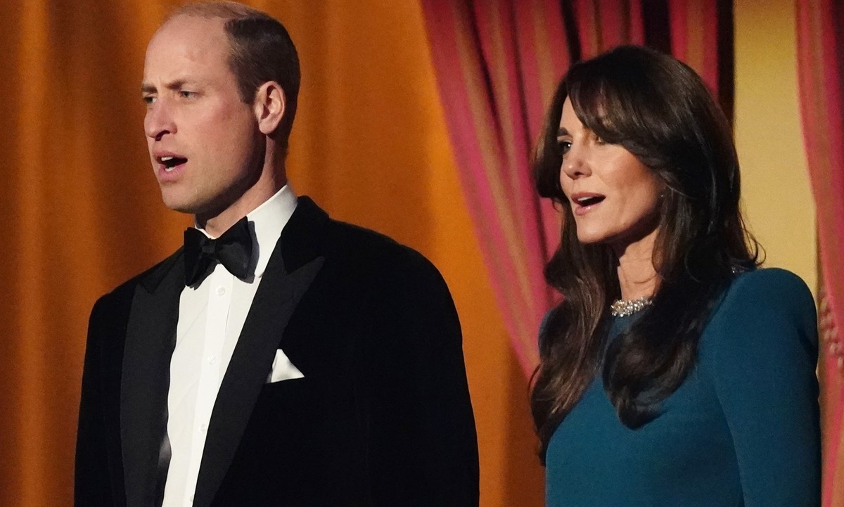 LONDON, ENGLAND - NOVEMBER 30: Prince William, Prince of Wales and Catherine, Princess of Wales sing the national anthem during the Royal Variety Performance before the Royal Variety Performance at th ...