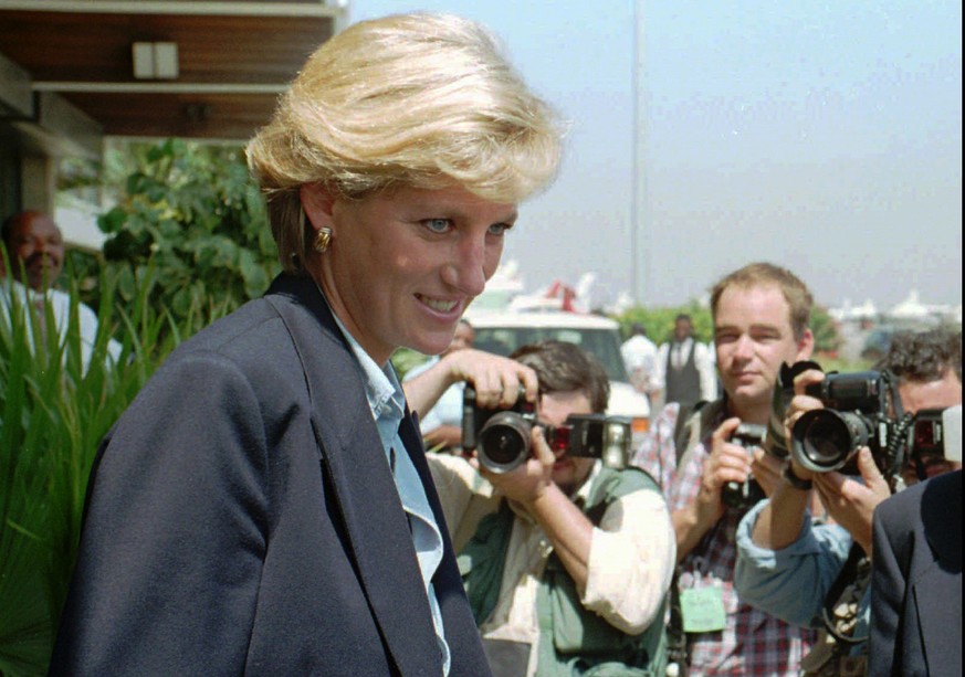 FILE - In this Thursday, Jan. 16, 1997 file photo, Britain&#039;s Princess Diana faces photographers as she leaves Luanda airport building to board a plane to Johannesburg at the end of her four-day v ...