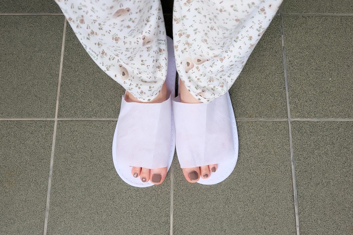 Selfie Feet Wearing White Slippers Indoor On The Ground Great For Any Use.