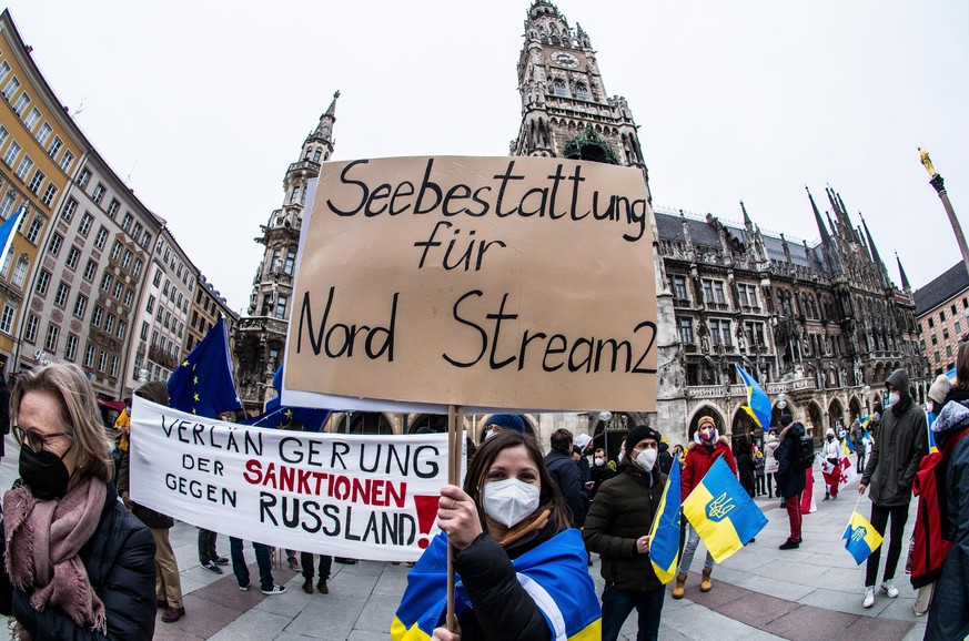 February 6, 2022, Munich, Bavaria, Germany: Ukrainians calling for sanctions against Russia and an end to the controversial Nordstream 2 pipeline that has been seen as a relic of corrupt Union politic ...