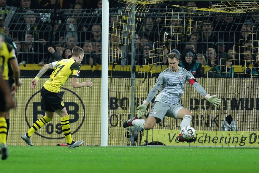 Eine Riese im Tor: Marco Reus vergibt eine Torchance gegen Manuel Neuer.