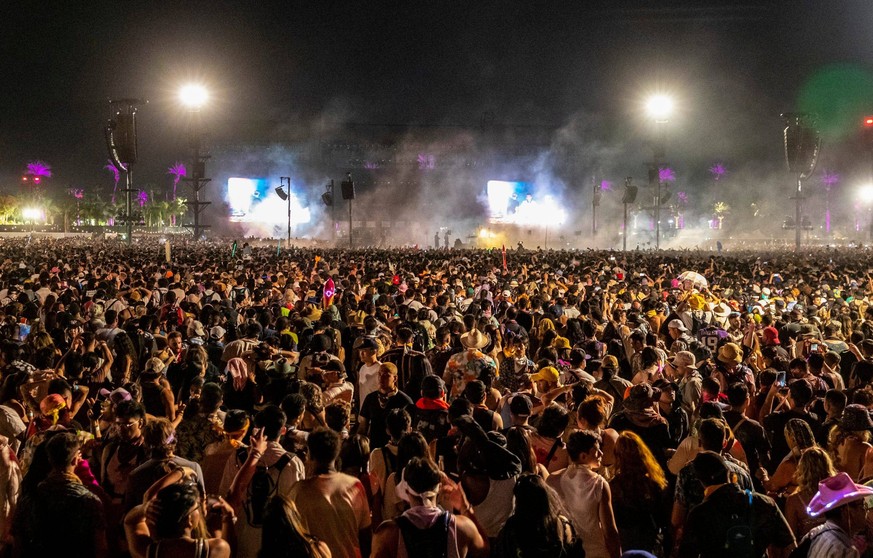 Syndication: Desert Sun Festivalgoers gather around an island stage to listen to Skrillex, Fred Again and Four Tet close out the Coachella Valley Music and Arts Festival at the Empire Polo Club in Ind ...