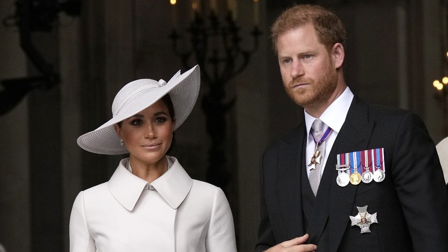 FILE - Prince Harry and Meghan Markle, Duke and Duchess of Sussex leave after a service of thanksgiving for the reign of Queen Elizabeth II at St Paul&#039;s Cathedral in London, Friday, June 3, 2022  ...