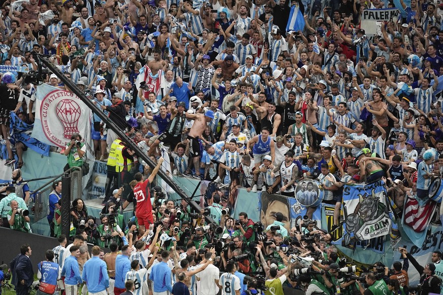 Argentina players celebrate with their fans at the end of the World Cup quarterfinal soccer match between the Netherlands and Argentina, at the Lusail Stadium in Lusail, Qatar, Saturday, Dec. 10, 2022 ...