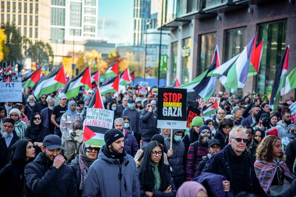 November 11, 2023, London, United Kingdom: A crowd of protestors hold placards and the Palestinian flag during the National March For Palestine Ceasefire Now Protest. Organizers called for a ceasefire ...