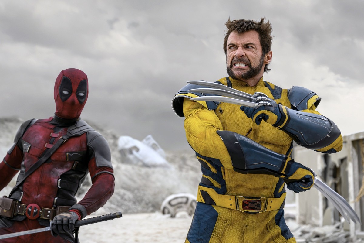 This image released by 20th Century Studios/Marvel Studios shows Ryan Reynolds as Deadpool/Wade Wilson, left, and Hugh Jackman as Wolverine/Logan in a scene from "Deadpool & Wolverine." ...