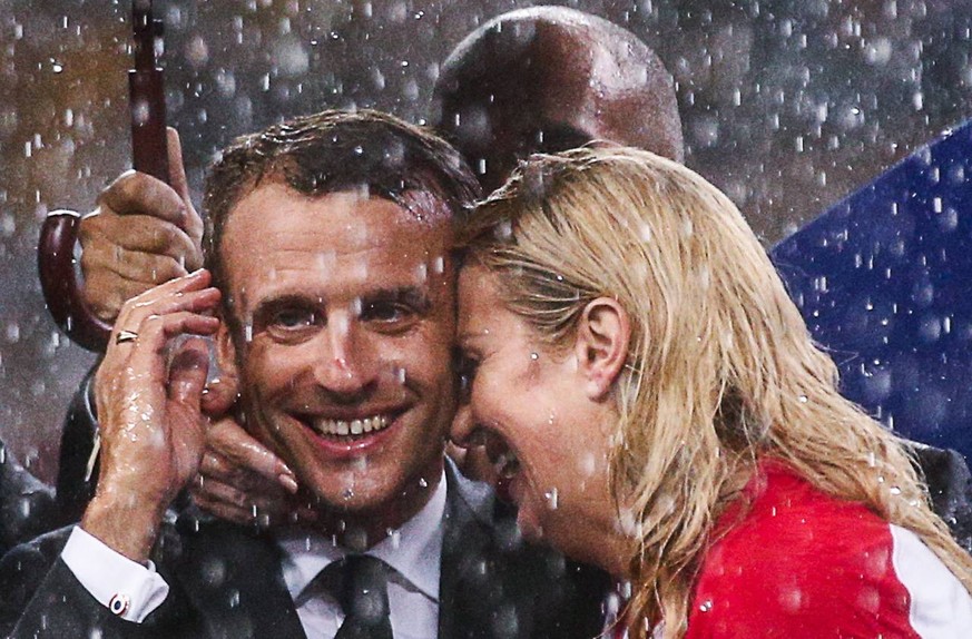 MOSCOW, RUSSIA - JULY 15, 2018: France s President Emmanuel Macron (L) and Croatia s President Kolinda Grabar-Kitarovic at the official award ceremony after the final match between France and Croatia  ...