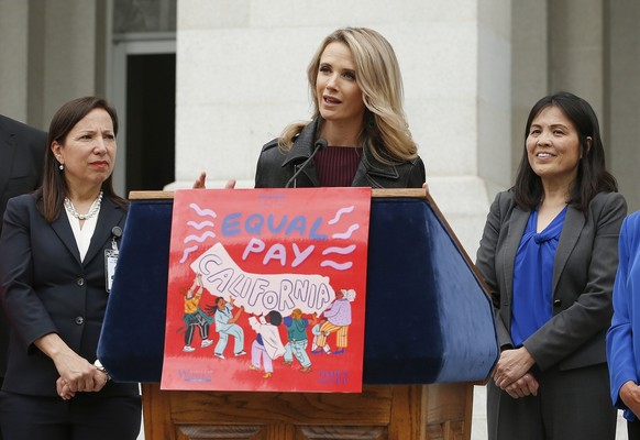 FILE - California first partner Jennifer Siebel Newsom, center, wife of Gov. Gavin Newsom, joined others to announce the #EqualPayCA campaign, in Sacramento, Calif., on April 1, 2019. Siebel Newsom, a ...