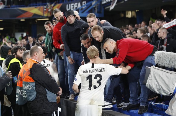 Martin Hinterregger of Eintracht Frankfurt is consoled by the Frankfurt fans during the UEFA Europa League match at Stamford Bridge, London. Picture date: 9th May 2019. Picture credit should read: Dar ...