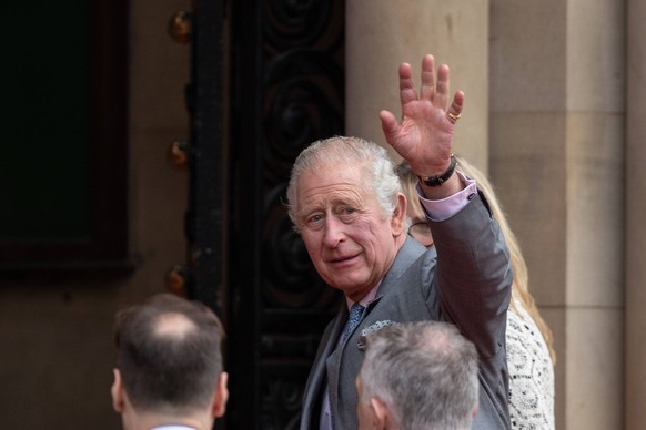 King Charles III waves to the to the people that have come out to see his visit in Bradford. King Charles III visits Centenary Square in Bradford, Yorkshire to watch performances by Bradford Brass Ban ...