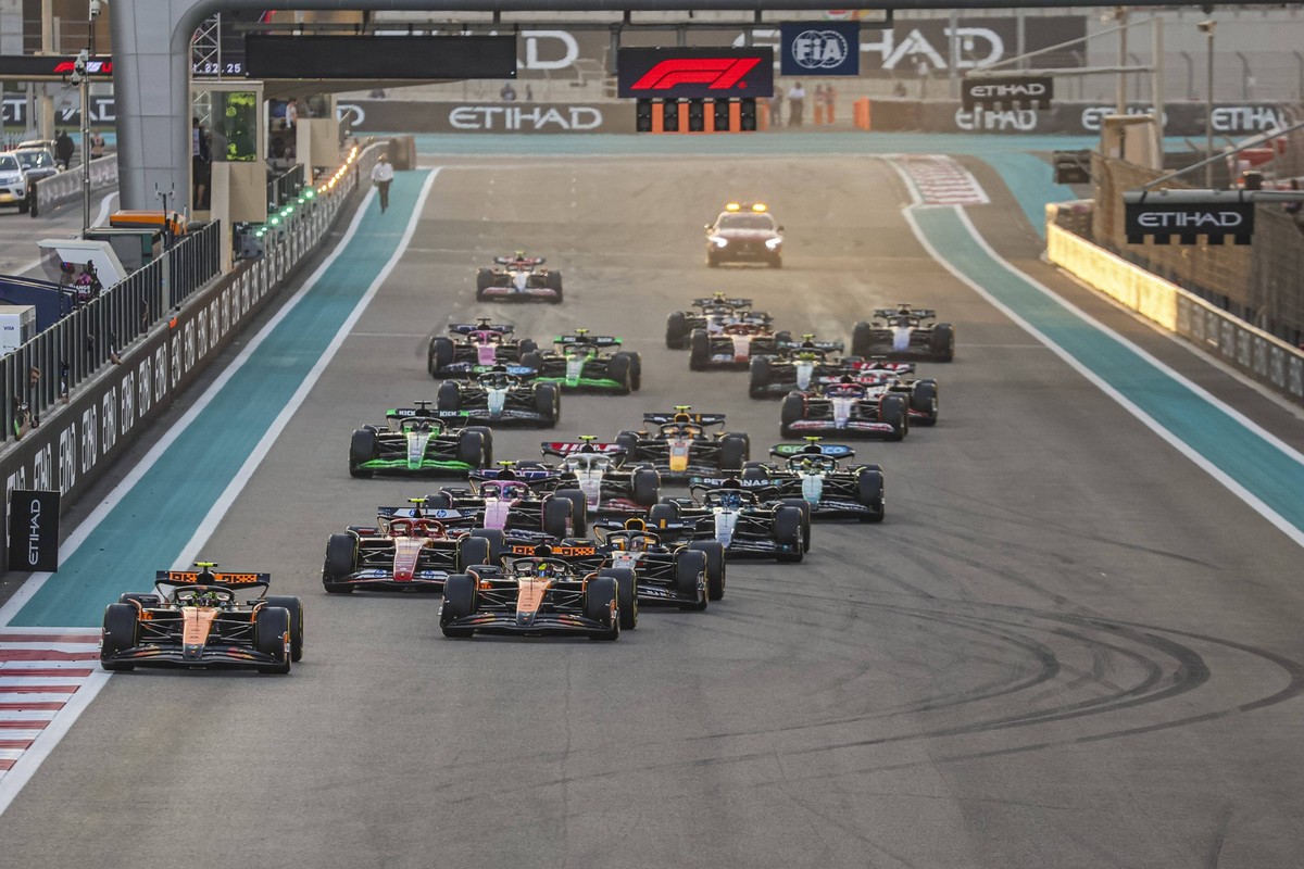 F1 Grand Prix Of Abu Dhabi The race starts with Lando Norris of McLaren Formula One Team with the MCL38 F1 car at the pole position leading the race from the start line and the first turn with all the ...