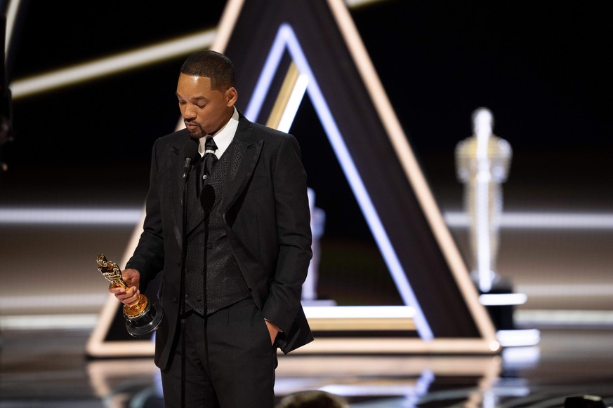 March 27, 2022, Hollywood, California, USA: WILL SMITH accepts the Oscar for Actor in a Leading Role during the live ABC telecast of the 94th Oscars at the Dolby Theatre. Earlier in the show, Smith to ...