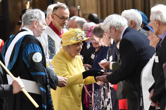 Maundy money sent by post. File photo dated 18/04/19 showing Queen Elizabeth II distributing the Maundy money during the Royal Maundy Service at St George's Chapel in Windsor. This year the 188 recipi ...