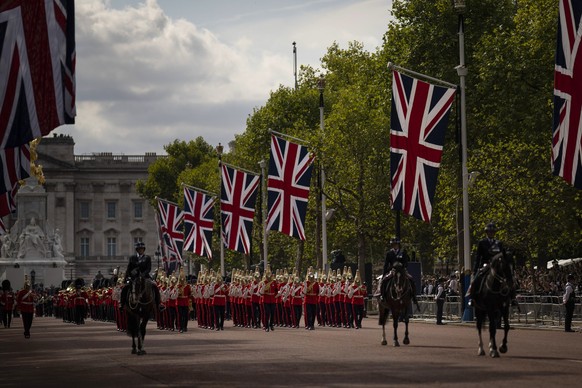 FILE - Guards escort the coffin of Queen Elizabeth II during a procession from Buckingham Palace to Westminster Hall in London, Wednesday, Sept. 14, 2022. On Friday, Sept. 16, The Associated Press rep ...