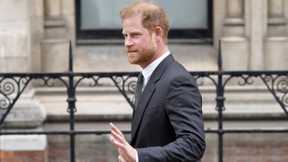 FILE - March 30, 2023, Great Britain, London: Britain's Prince Harry leaves the Court of Justice.  In the case of Prince Harry and other British celebrities claiming compensation for wiretapping phones...