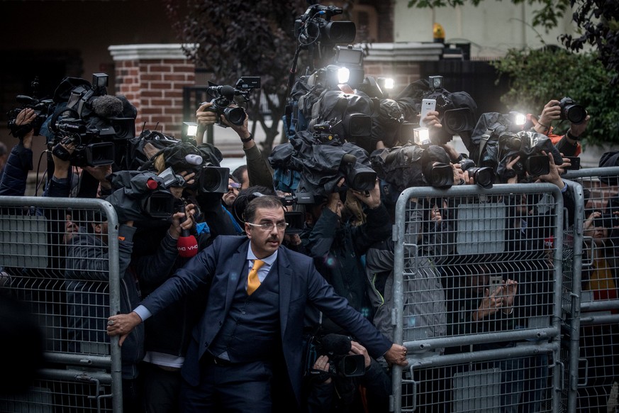 Picture nominated for World Press Photo of the Year at the World Press photo contest shows: An unidentified man tries to hold back the press on 15 October, 2018, as Saudi investigators arrive at the S ...