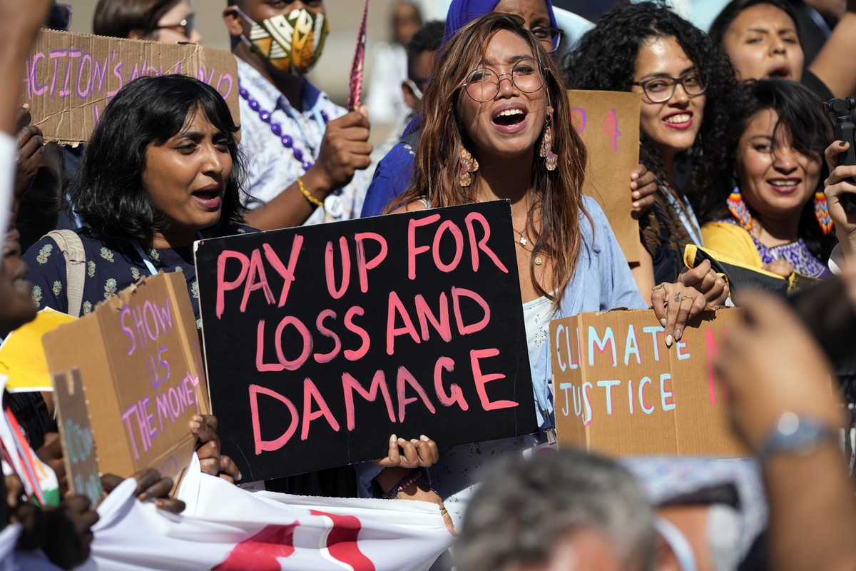 FILE - Mitzi Jonelle Tan, of the Philippines, center, participates in a Fridays for Future protest calling for money for climate action at the COP27 U.N. Climate Summit, Nov. 11, 2022, in Sharm el-She ...