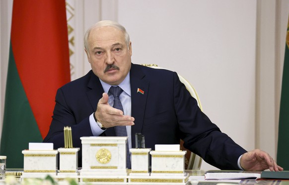 Belarusian President Alexander Lukashenko leads a cabinet meeting in Minsk, Belarus, Friday, Oct. 22, 2021. Belarusian authorities on Friday abolished mask mandates less than two weeks after their int ...