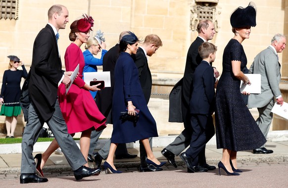 Prince William, Kate Duches of Cambridge, Meghan, Duchess of Sussex, Prince Harry, Prince Edward, Sophie, Countess of Wessex, and Prince Charles, from left, walk back following the wedding of Princess ...