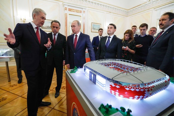 MOSCOW, RUSSIA - OCTOBER 3, 2017: Moscow Mayor Sergei Sobyanin, Russia s Deputy Prime Minister Vitaly Mutko, Russia s President Vladimir Putin and Russian Presidential Aide Igor Levitin (L-R front) se ...