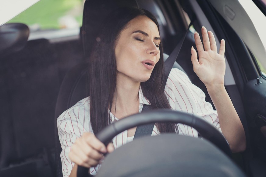 Close-up portrait of her she nice-looking attractive lovely brunette, dreamy girl riding new car enjoying having fun listening music singing pop rock soul jazz single song pout lips good morning