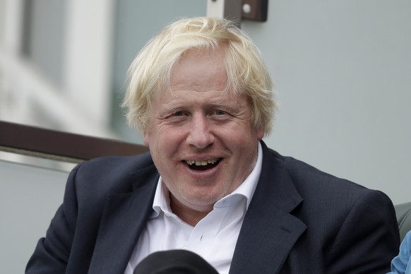 FILE - In this Saturday, Sept. 8, 2018 file photo, Britain&#039;s former Foreign Secretary Boris Johnson reacts to seeing photographers taking his picture as he sits in a spectator seat whilst attendi ...