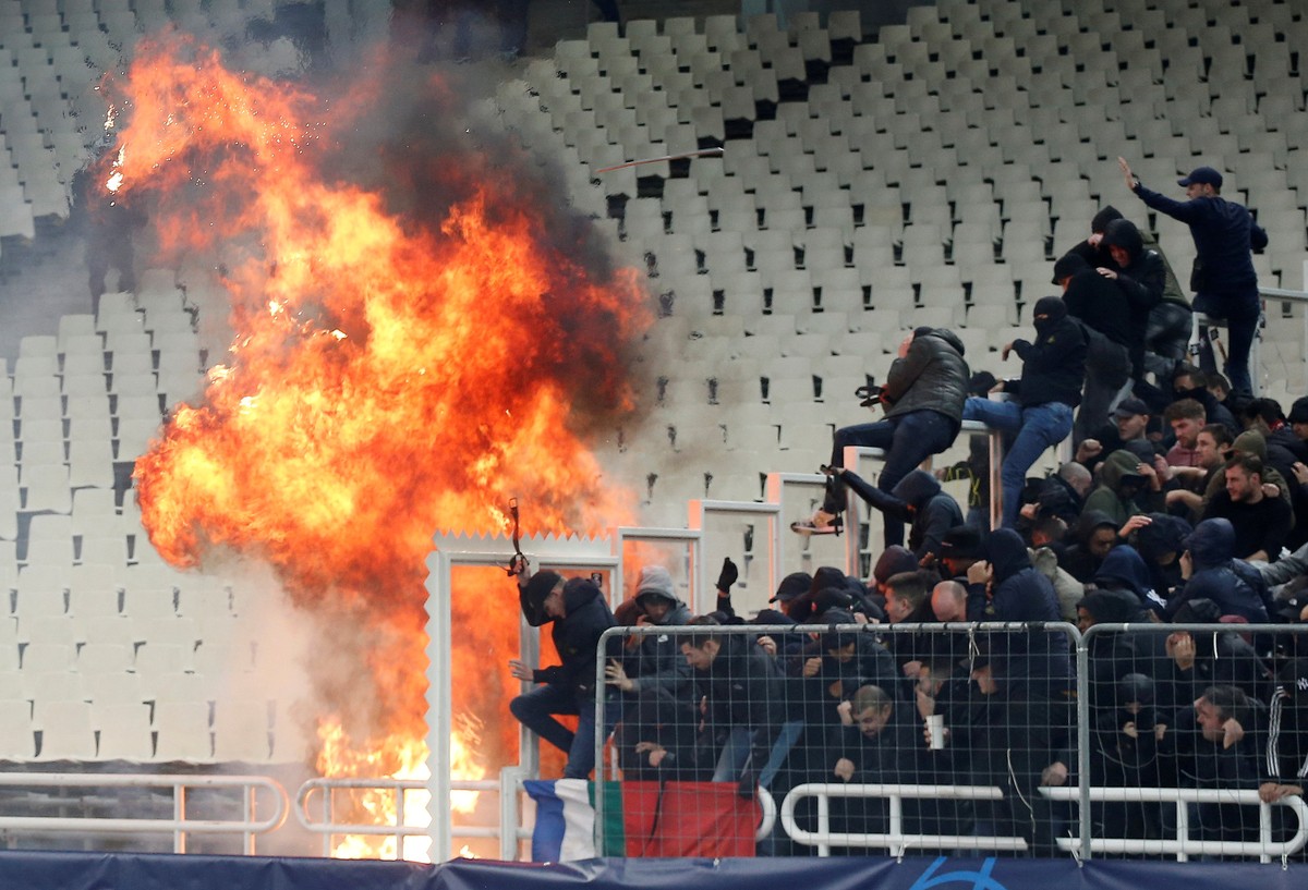 Soccer Football - Champions League - Group Stage - Group E - AEK Athens v Ajax Amsterdam - OAKA Spiros Louis, Athens, Greece - November 27, 2018 General view of fans moving away from a fire inside the ...