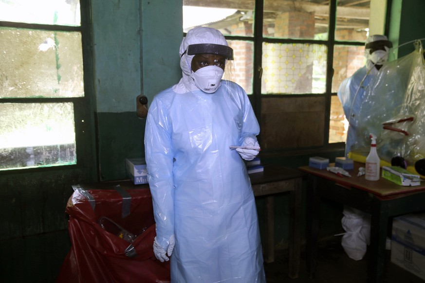 In this photo taken on Sunday, May 13, 2018, a health care worker wears virus protective gear at a treatment center in Bikoro Democratic Republic of Congo. Congo&#039;s latest Ebola outbreak has sprea ...