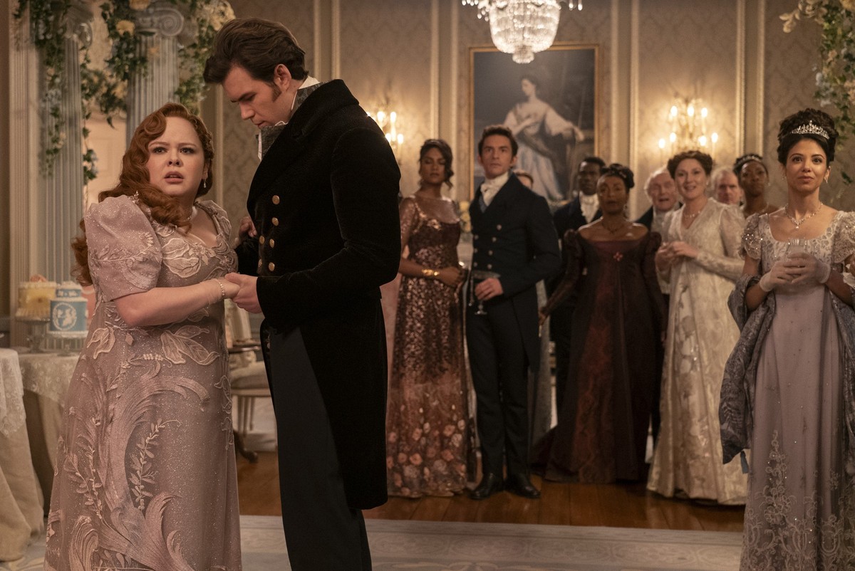 Bridgerton. (L to R) Nicola Coughlan as Penelope Featherington, Simone Ashley as Kate Sharma, Jonathan Bailey as Anthony Bridgerton, Victor Alli as John Stirling, Adjoa Andoh as Lady Agatha Danbury, R ...
