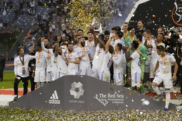 FILE - Real Madrid's payers celebrate after winning the Spanish Super Cup final soccer match between Real Madrid and Athletic Bilbao at King Fahd stadium in Riyadh, Saudi Arabia, Sunday, Jan. 16, 2022 ...