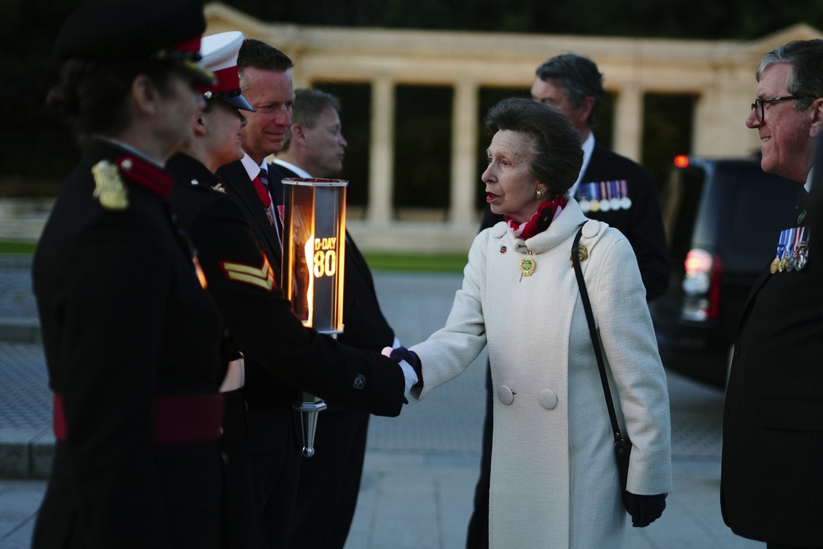 Britain&#039;s Princess Anne, President of the Commonwealth War Graves Commission, shakes hands with Cadet Corporal Grace Maddison, second left, as she arrives for the Commonwealth War Grave Commissio ...