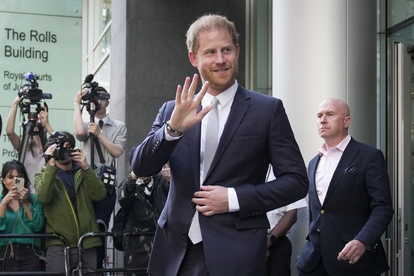 FILE - Prince Harry leaves the High Court after giving evidence in London, on June 7, 2023. Prince Harry won his phone hacking lawsuit Friday Dec. 15, 2023 against the publisher of the Daily Mirror an ...