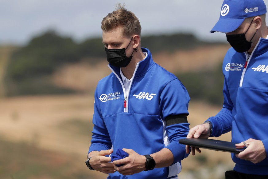 Haas driver Mick Schumacher of Germany, center, gestures while inspecting the track ahead of the Portugal Formula One Grand Prix at the Algarve International Circuit near Portimao, Portugal, Thursday, ...