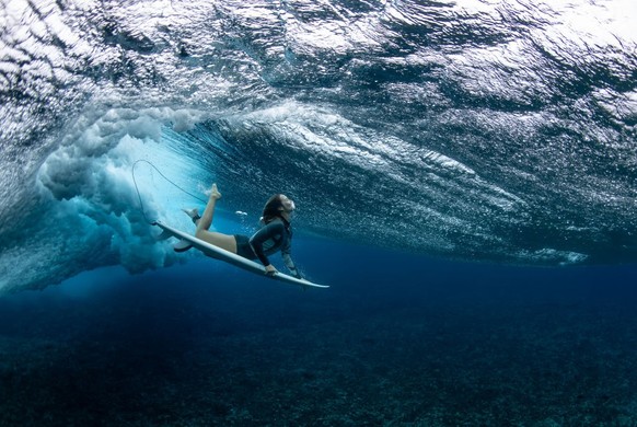 TEAHUPO&#039;O, FRENCH POLYNESIA - AUGUST 19: Australian surfer Olivia Ottaway dives under a wave on August 19, 2023 in Teahupo&#039;o, French Polynesia. Teahupo&#039;o has been hosting the WSL Tahiti ...