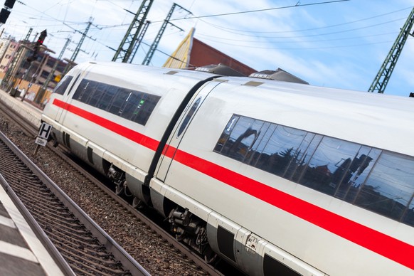 a german train passes a train station