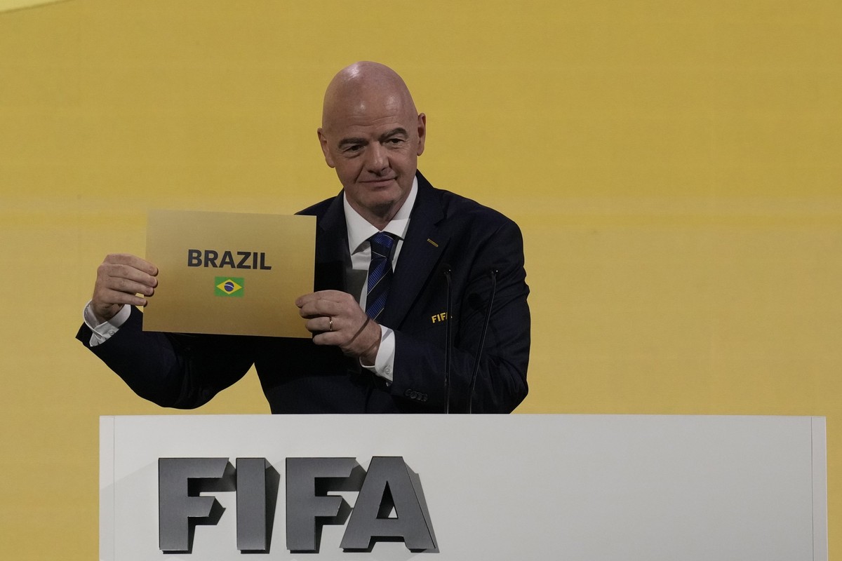 FIFA President Gianni Infantino announces that Brazil is chosen to host soccer's 2027 Women's World Cup at the FIFA Congress in Bangkok, Thailand, Friday, May 17, 2024.(AP Photo/Sakchai Lali ...