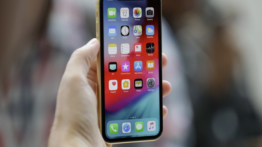 The new Apple iPhone XR is on display at the Steve Jobs Theater after an event to announce new products Wednesday, Sept. 12, 2018, in Cupertino, Calif. (AP Photo/Marcio Jose Sanchez)
