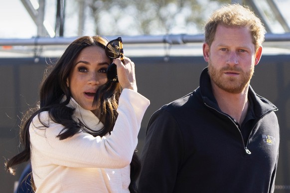 FILE - Prince Harry and Meghan Markle, Duke and Duchess of Sussex visit the track and field event at the Invictus Games in The Hague, Netherlands, Sunday, April 17, 2022. Prince Harry and his wife, Me ...